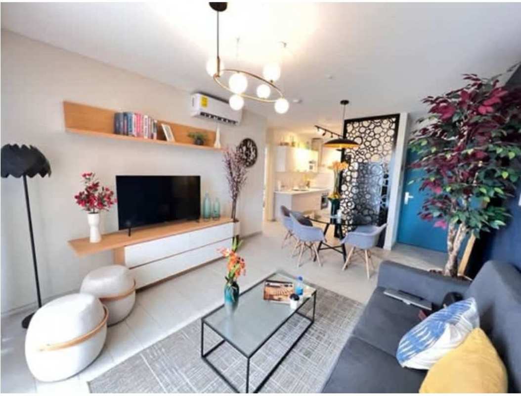 Bright living dining open space with large window balcony access in PH Demetra Panama City