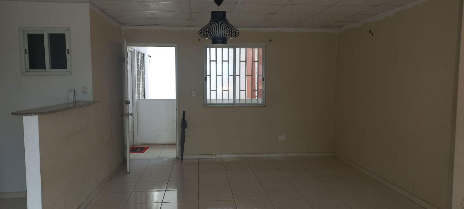 Affordable apartment living dining with breakfast bar, window security bars, tiled floors PH Ambar Panama