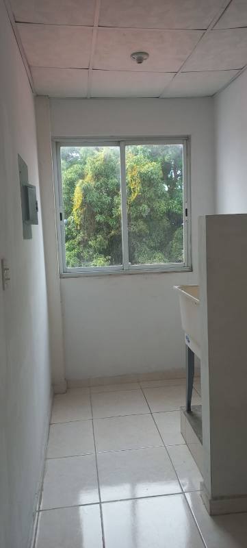 Compact laundry space with window and utility sink in PH Ambar Pedregal Panama
