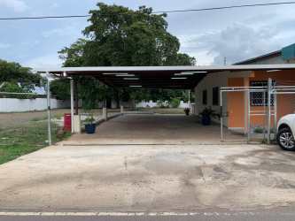 Small residence with tiled porch and open lot La Mitra La Chorrera Panama