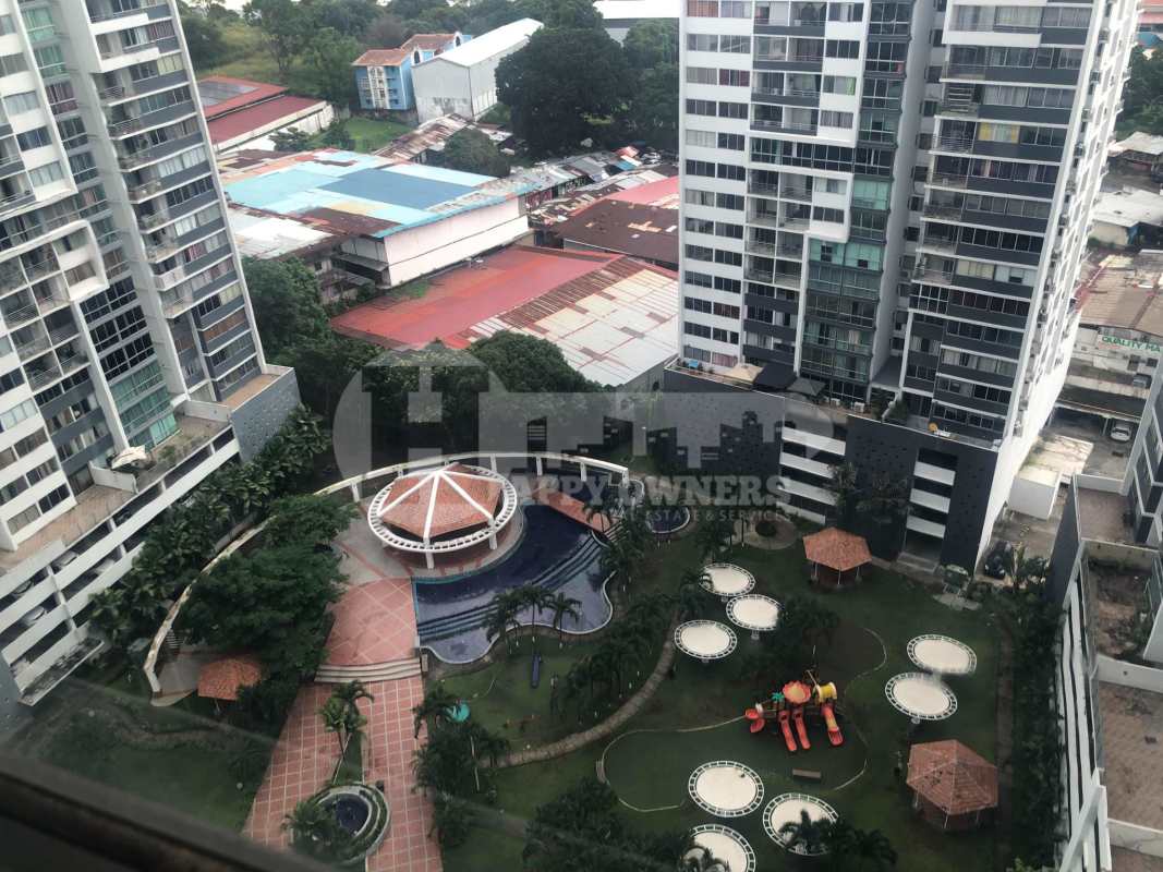 Aerial view of high-rise towers, swimming pool, gazebos and landscaped gardens PH Central Park Panama