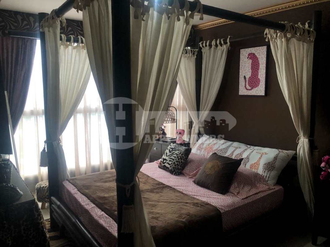 Courtyard with palm trees, playground and brick walkways in PH Central Park Panama