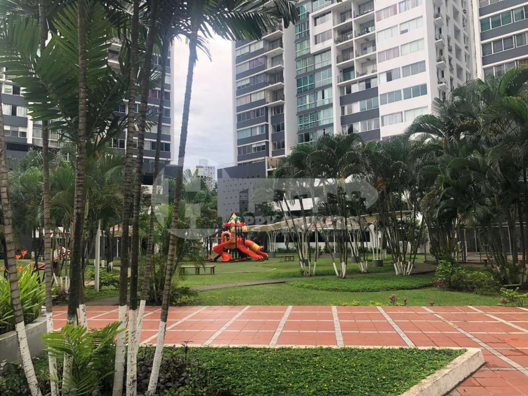 Bedroom with four-poster canopy bed and natural light in PH Central Park Panama