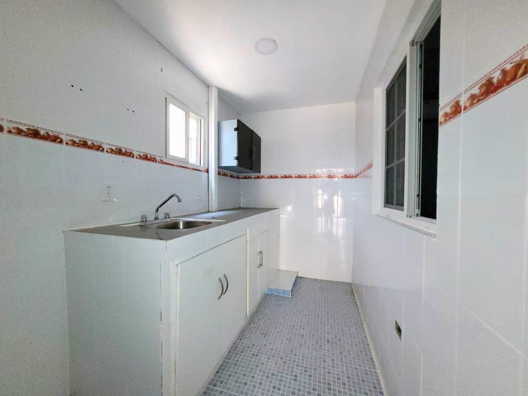 Retro style bathroom with blue tiles, pedestal sink, and shower in San Francisco property