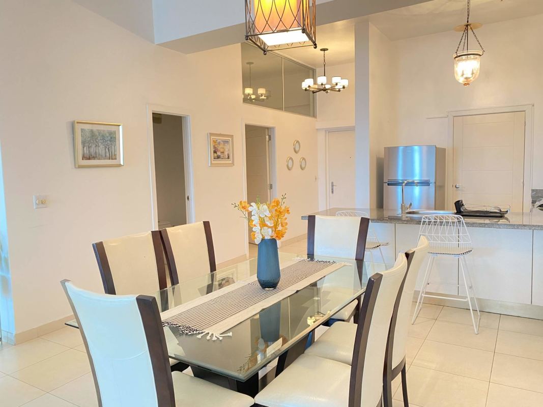 Modern rooftop infinity pool with ocean and skyline view at PH Waters on the Bay