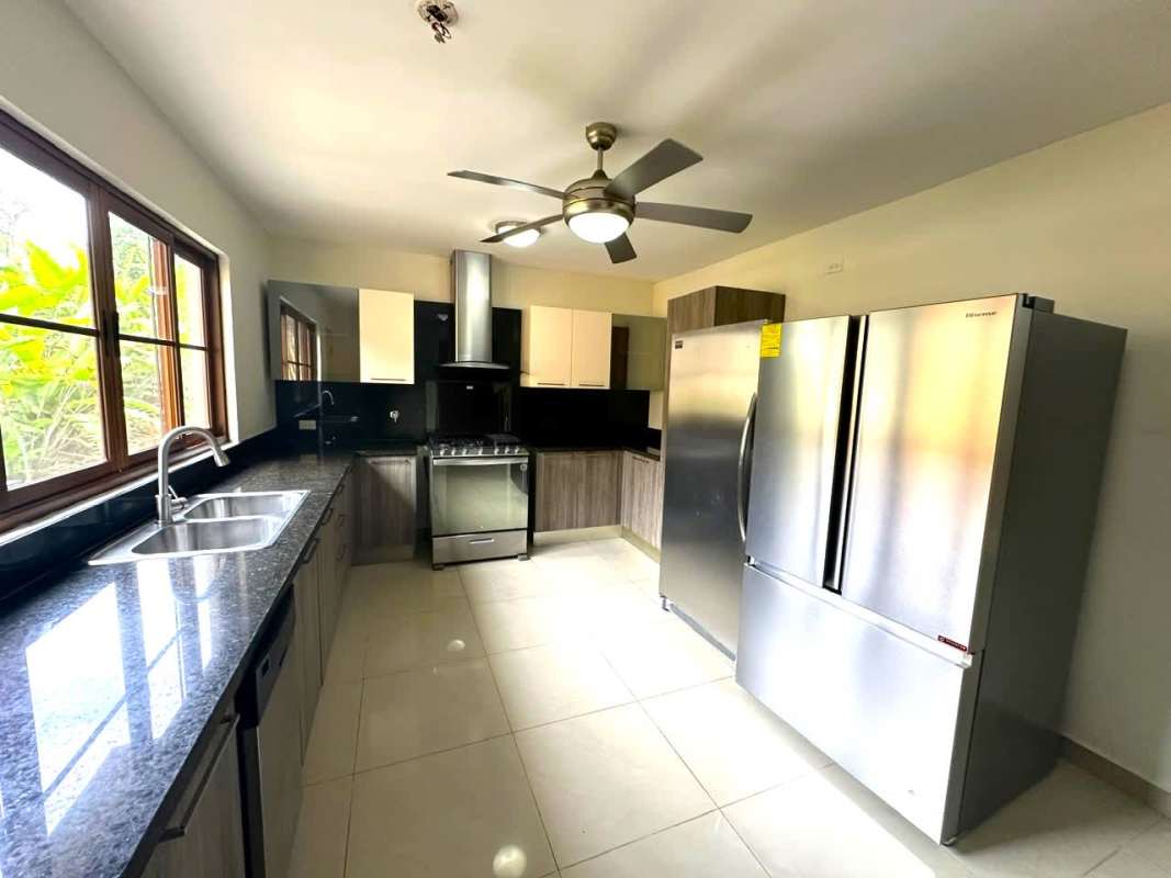 Bright staircase area with marble floors in two-story luxury house Senderos Clayton