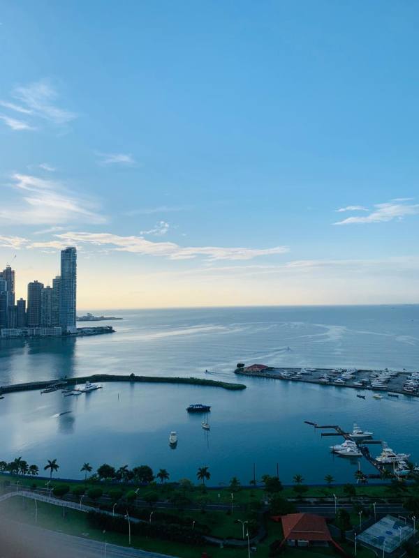 Panoramic aerial of Avenida Balboa coastline, marina, yachts, and skyscrapers Panama City