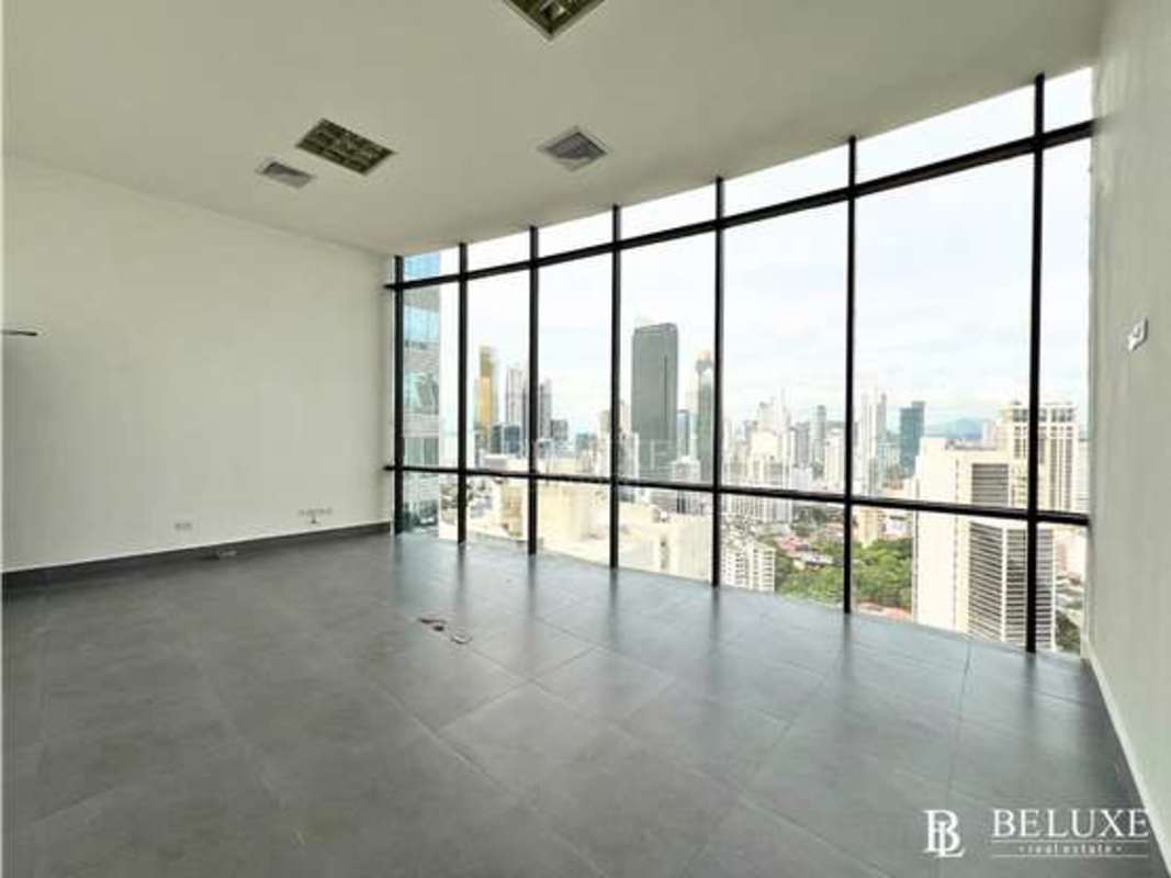 High-rise office space panoramic windows overlooking city skyline Torre Generali Panama City