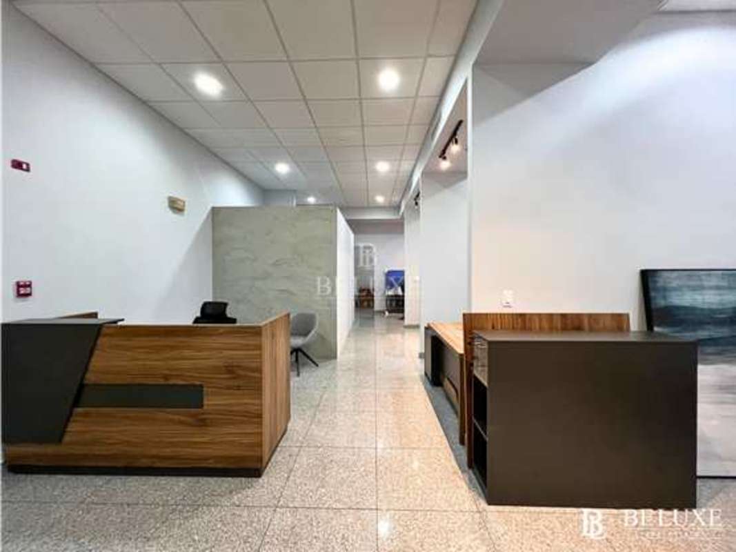 Private glass-walled meeting room with furnishings in Habitats Plaza Bella Vista Panama City