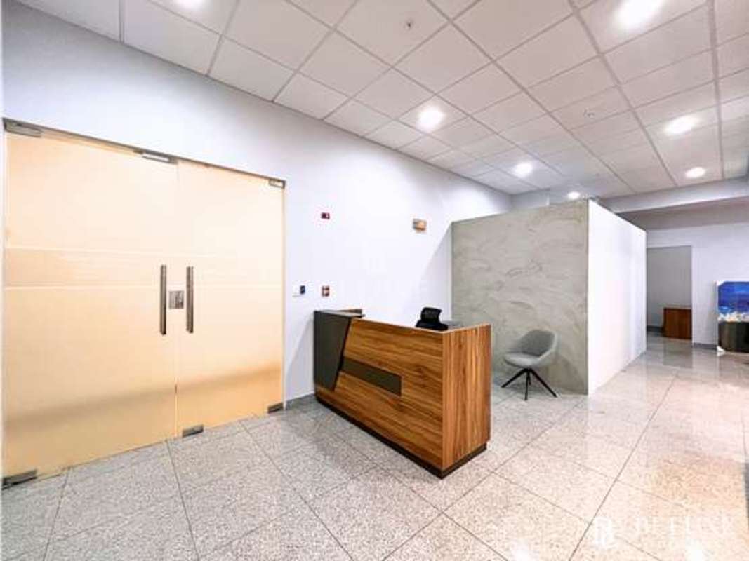 Modern office workspace area with large windows and city views Habitats Plaza Panama City