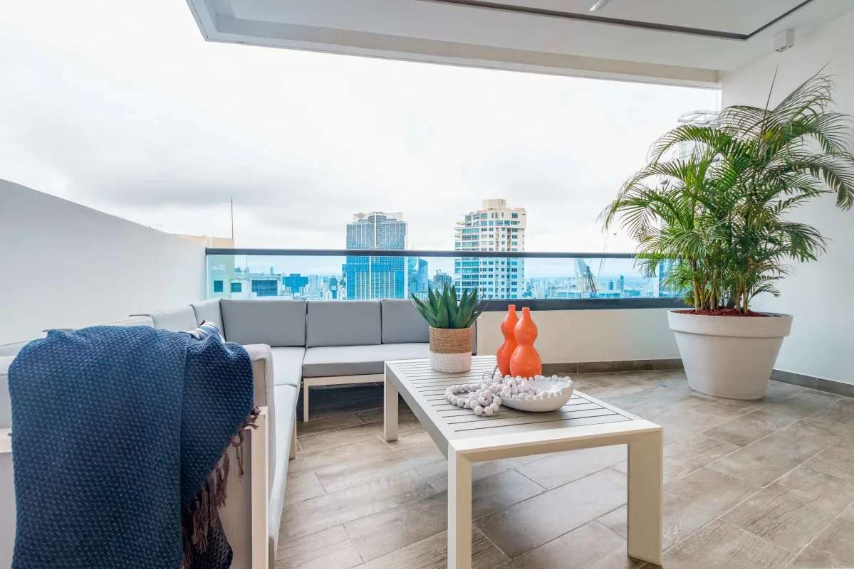 Spacious bedroom with balcony and ocean views at PH Deluxe Punta Paitilla Panama