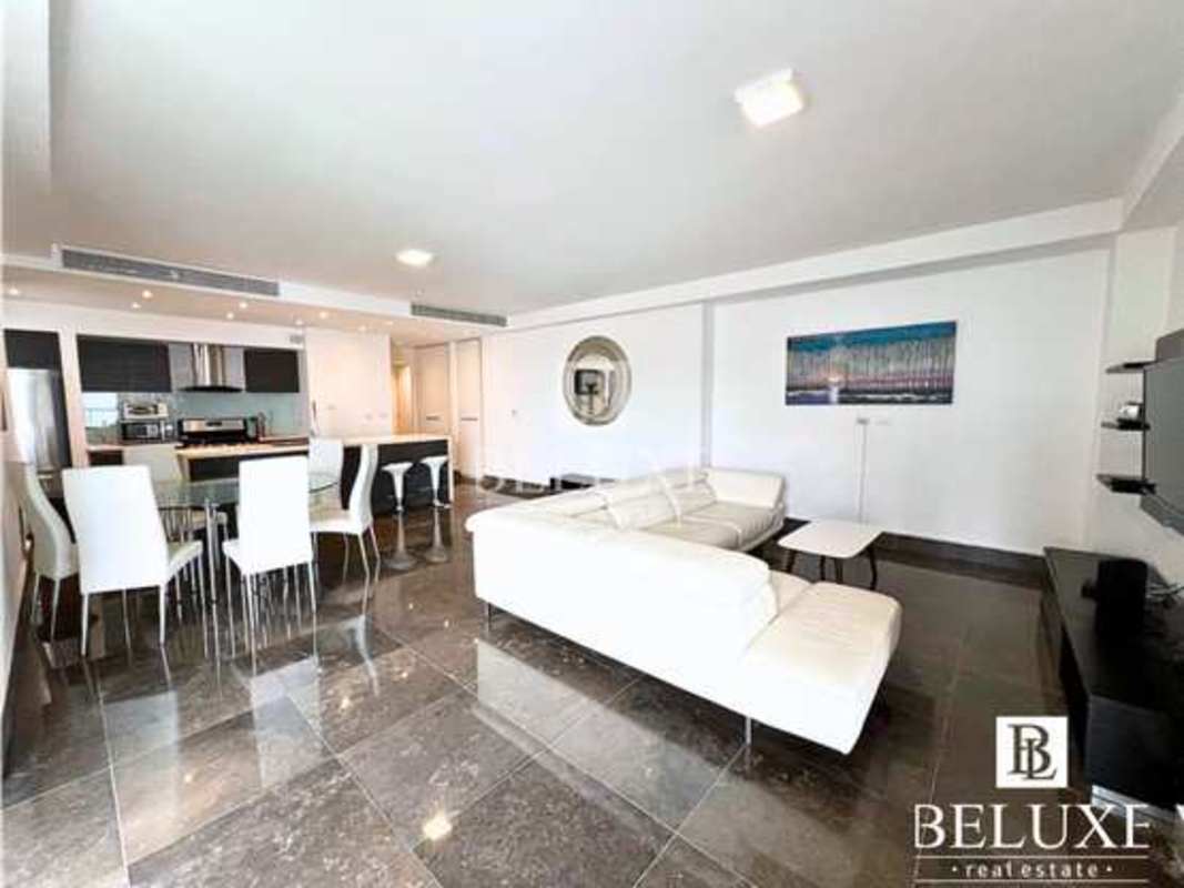 Modern kitchen with island bar and high-end appliances in luxury PH Yoo Panama condo