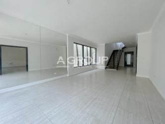 Community social area with covered BBQ space and pool at Nativa Panama Pacifico