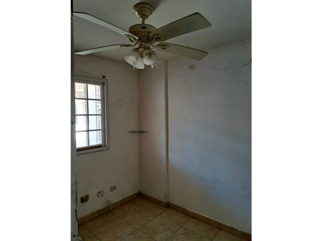 Large living room with ceramic tile floors, natural light, traditional chandelier Panama City house