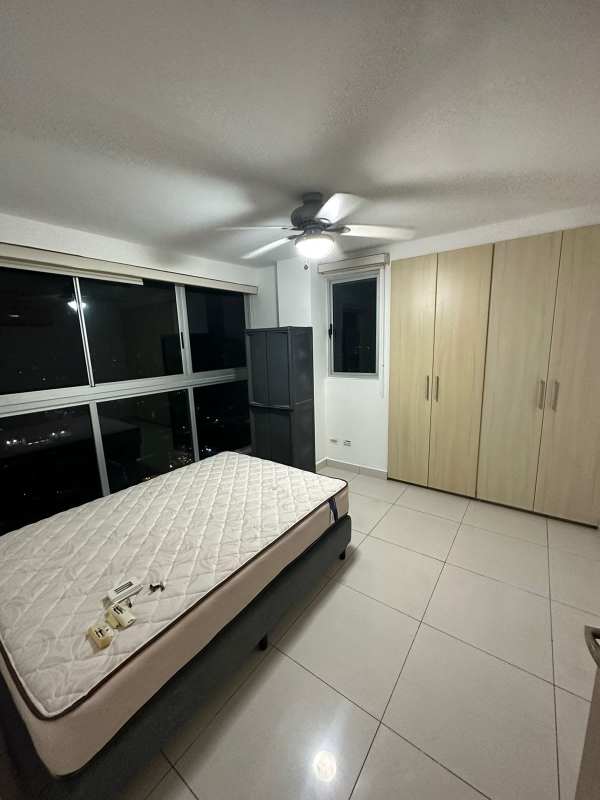 Master bedroom featuring ocean views, ceiling fan, built-in closet in PH Moon Tower Panama City