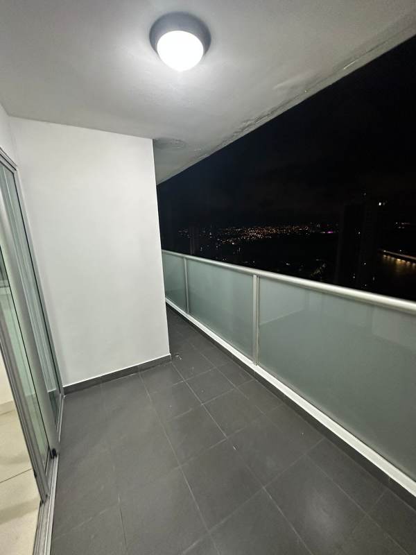 Open kitchen with granite countertops and stainless steel appliances in PH Moon Tower Panama City