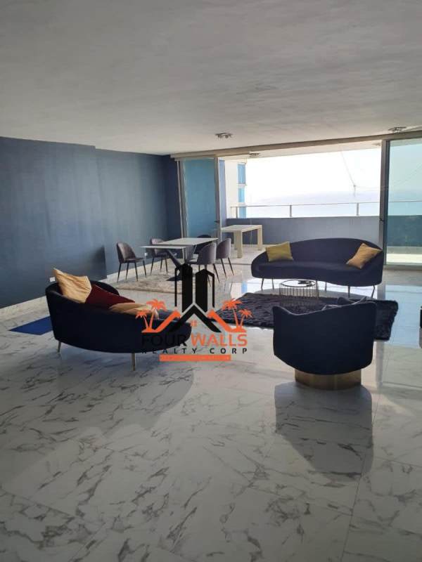 Open-concept living dining with panoramic ocean view at PH Waters on the Bay Panama