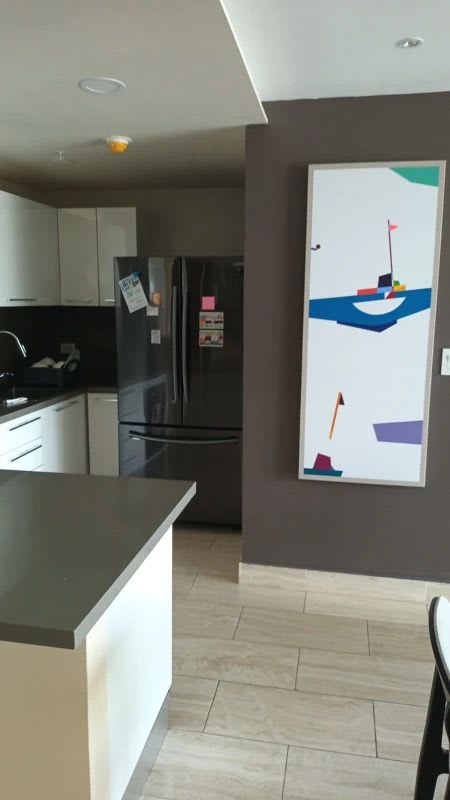 Contemporary kitchen with quartz counters, appliances in PH The Regent Panama