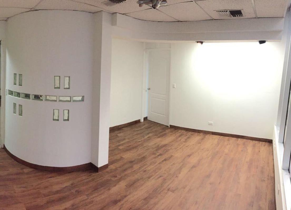 Spacious reception area with wood flooring, glass panels and bright lighting in Plaza Ejecutiva, Obarrio Panama