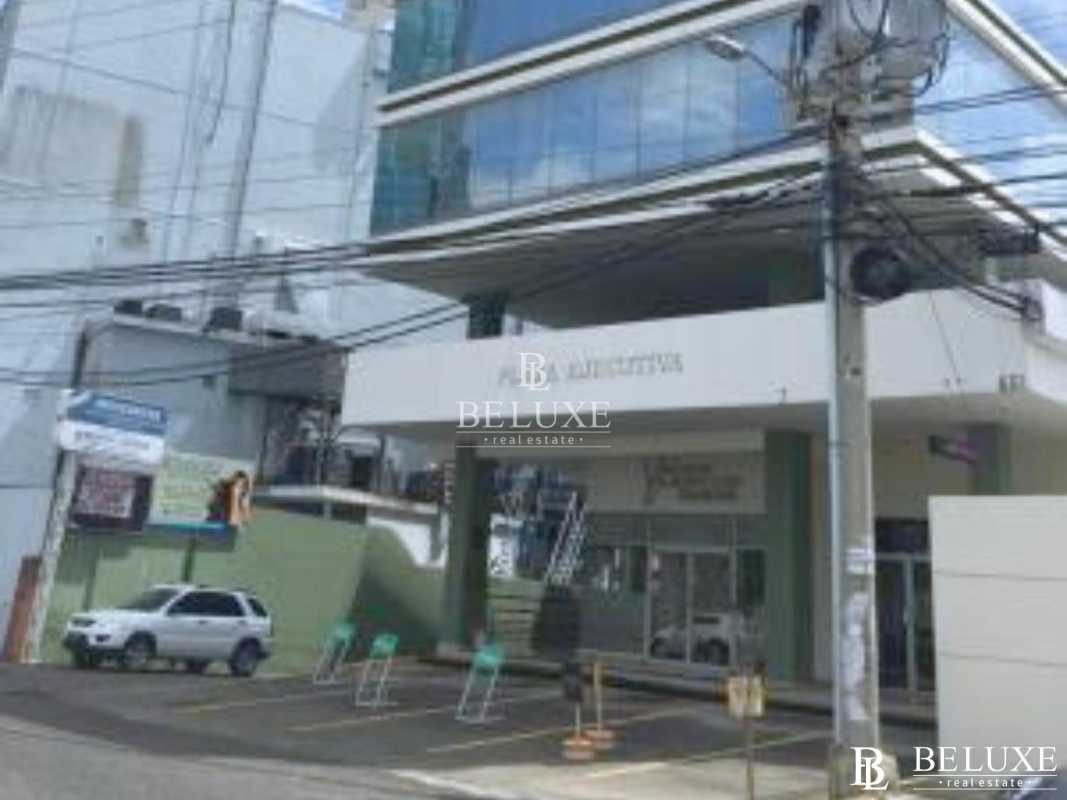 City skyline seen through office window vertical blinds PH Plaza Ejecutiva Bella Vista