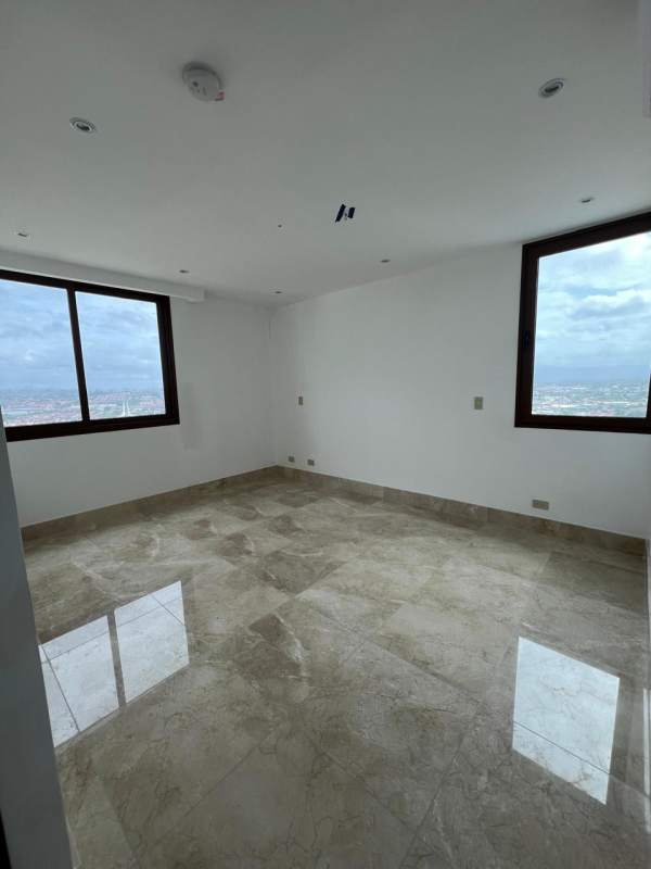 Bedroom with marble floors, air conditioning and window overlooking golf course at The Colonial Santa Maria Panama