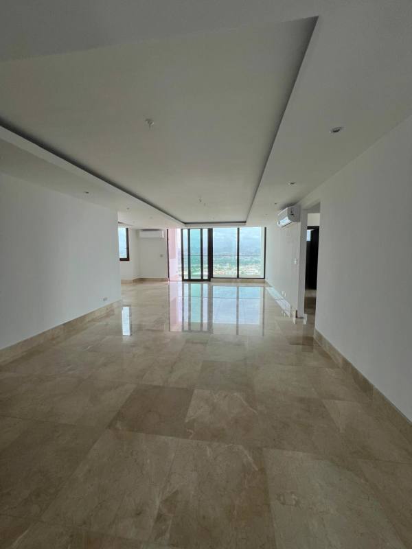 Spacious living dining room with marble flooring and large sliding glass doors in The Colonial Santa Maria Panama