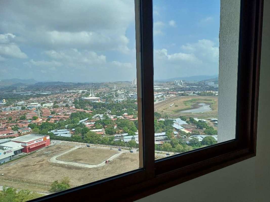 Expansive window view over golf course and city skyline from The Colonial Santa Maria Panama