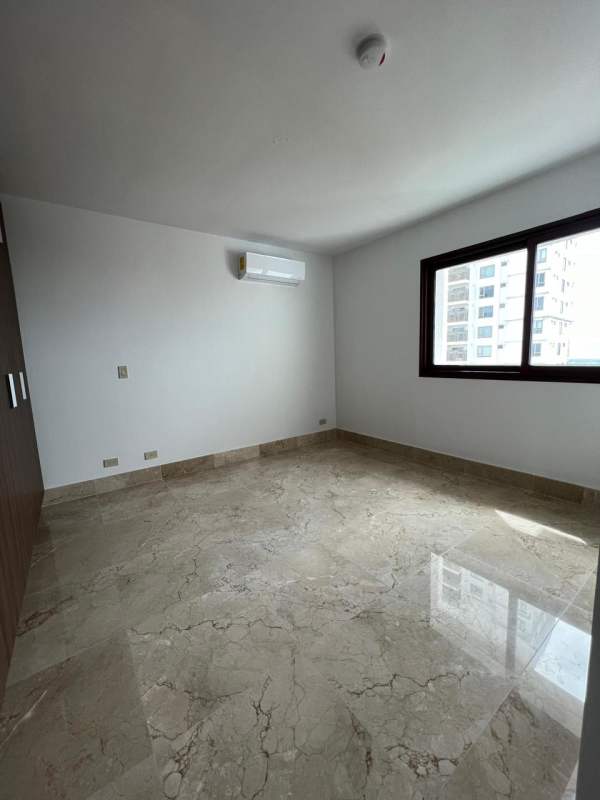 Modern bright bedroom with marble floor, AC and closet in The Colonial Santa Maria Panama