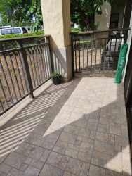 Apartment balcony with lush garden views at River Valley Panama Pacifico