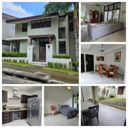 Spacious living area with tile floors, large windows, natural light in house Panama Pacifico Nativa