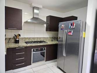 Bedroom with split AC and closet overlooking garden in house Panama Pacifico