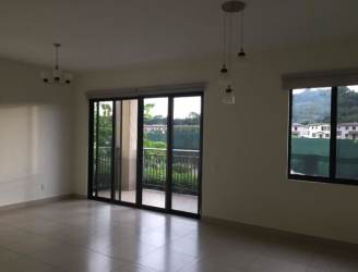 Bathroom with glass shower and wood vanity in River Valley Panama Pacifico Condo