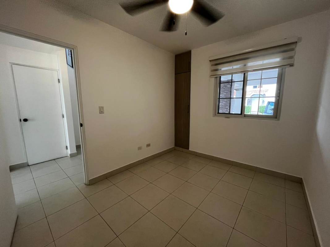 Large living room with sliding glass doors to garden terrace in PH Quintas de Versalles in Panama City