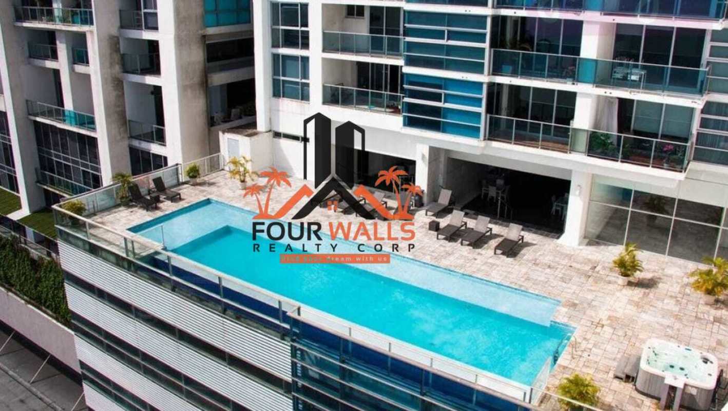 Aerial of pool area outdoor lounge apartment PH Waters On The Bay Panama City