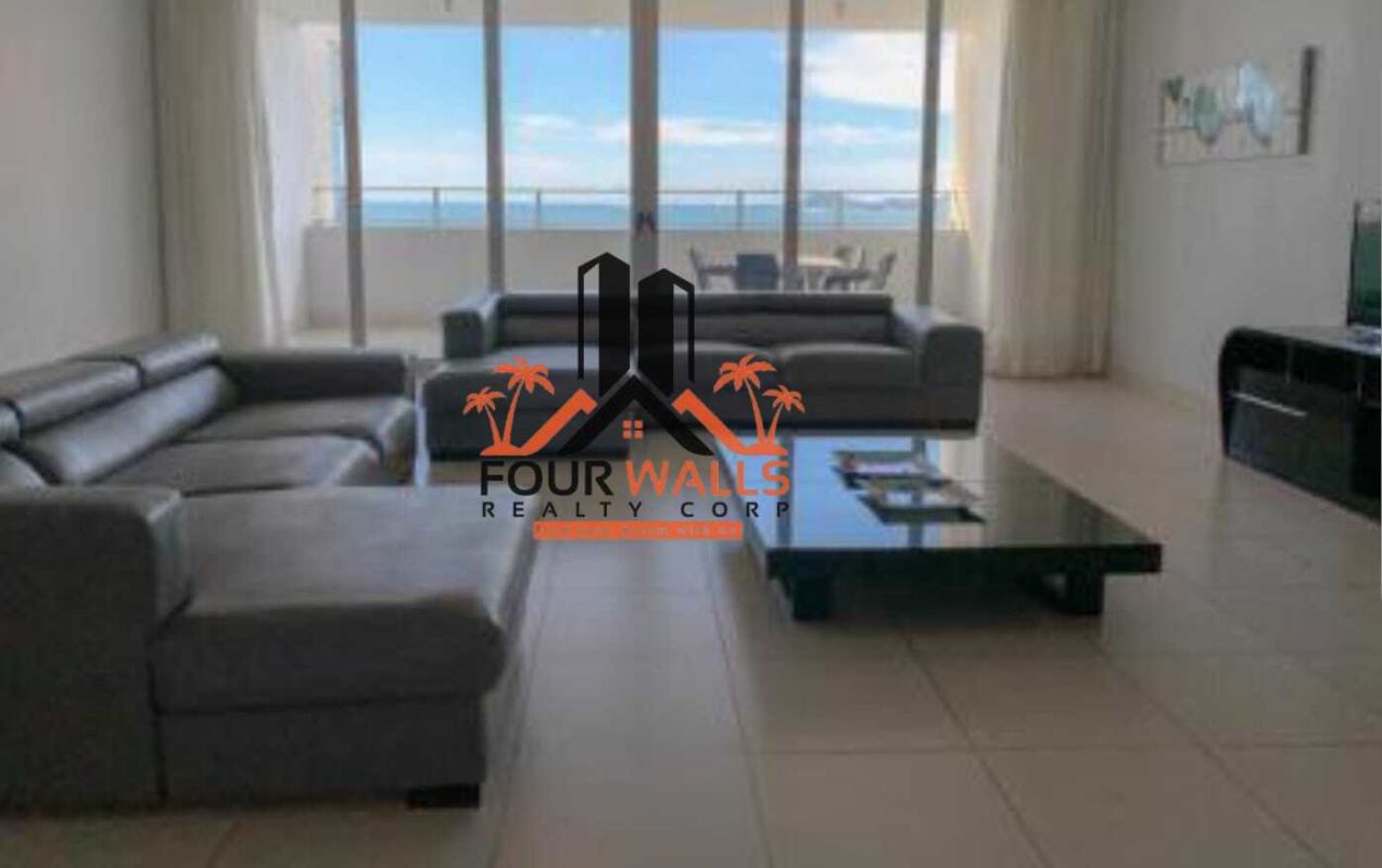 Modern bright living room with floor to ceiling windows and ocean views in PH Waters On The Bay Panama