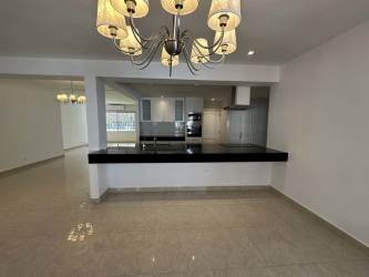 Open kitchen with island and dining area modern rental home Howard Panama