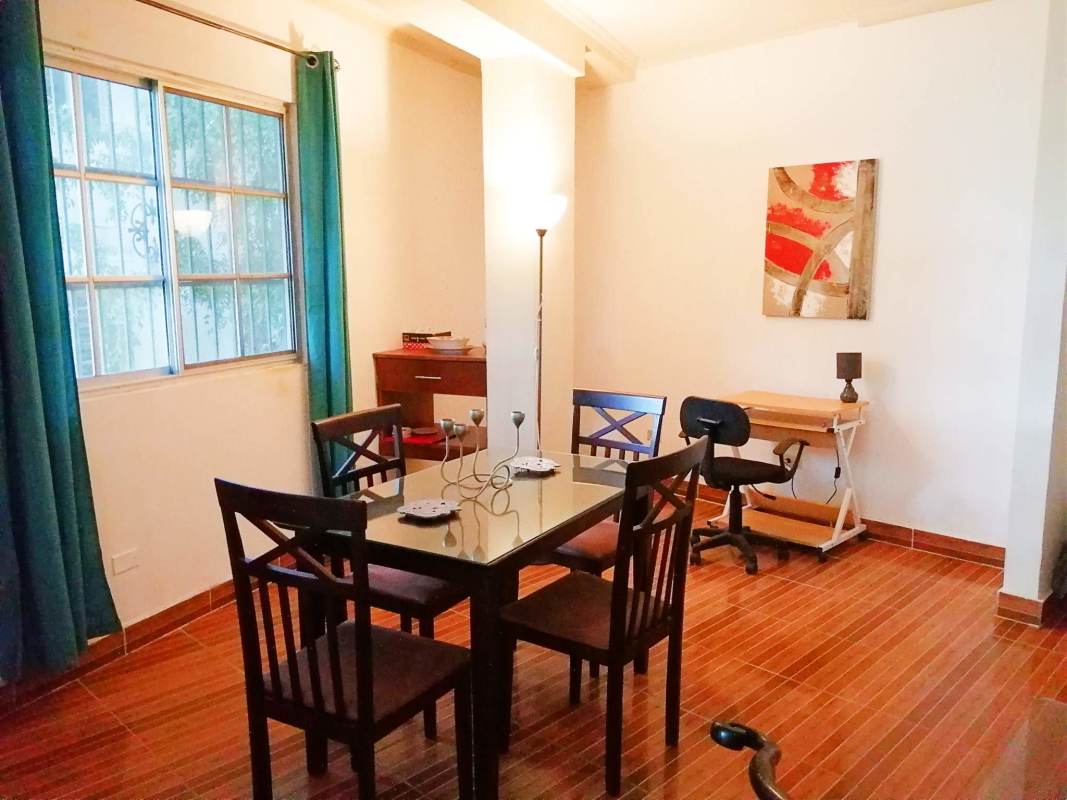 Large loft bedroom with bright natural light in Clayton Village apartment