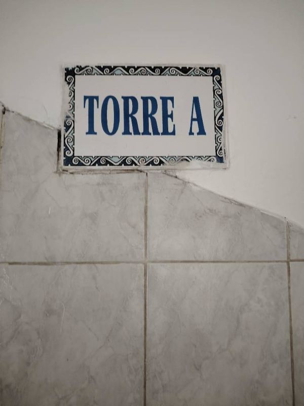 Spanish-style ceramic tile sign Plaza Madrid at entrance San Francisco Panama