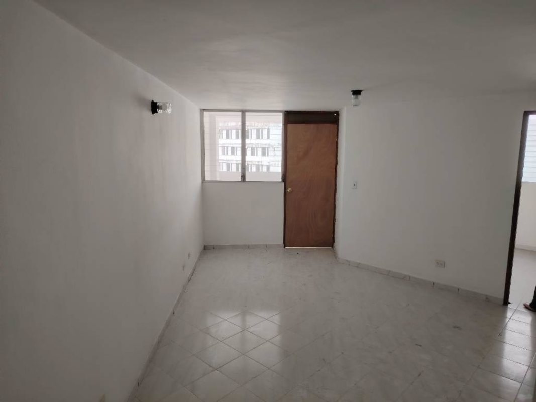 Bright living room empty space tiled floor wooden door PH Plaza Madrid Panama