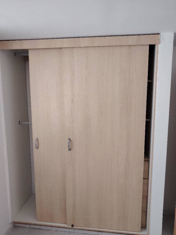 Bedroom closet with sliding doors light wood modern PH Plaza Madrid Carrasquilla Panama