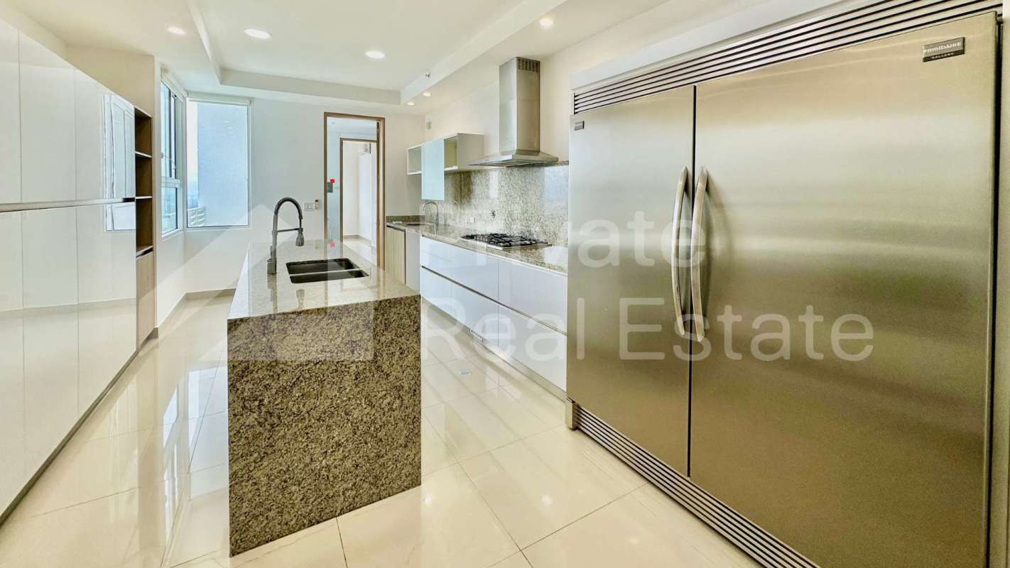 Modern master bath with marble counters and glass shower in PH Aria Panama