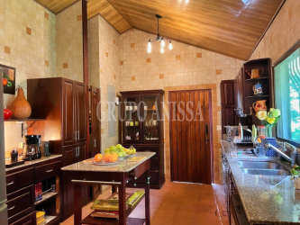 Rustic wood kitchen vaulted ceiling and island Panama mountain villa