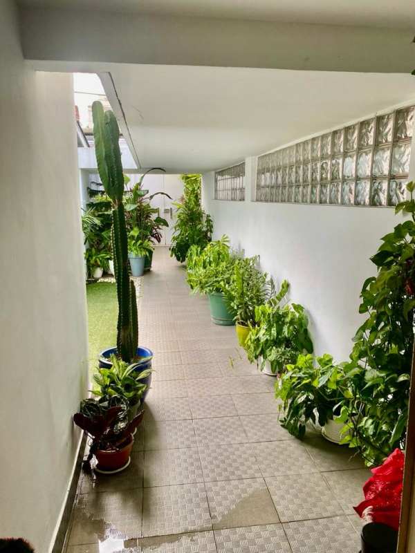 Bright spacious master bedroom with tile floors and garden view La Alameda Betania Panama City