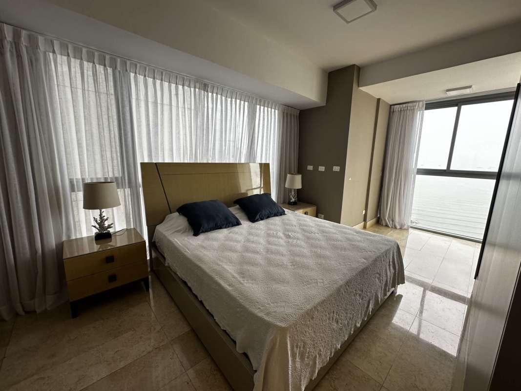 Spacious master bedroom with walk-in closet and ocean views in PH Yoo Panama