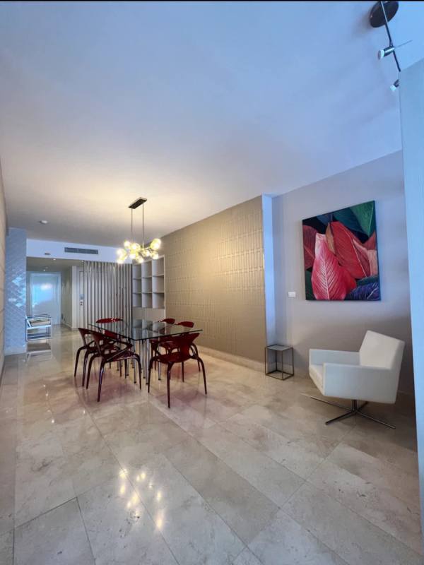Modern bedroom with floor to ceiling windows and ocean view at Yoo Panama