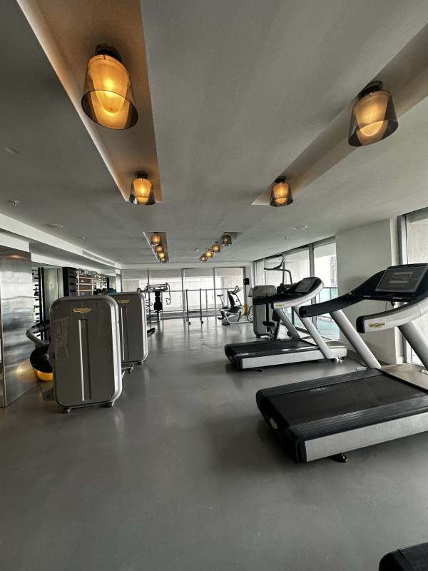 Gym with panoramic city views and modern fitness equipment in Yoo Panama