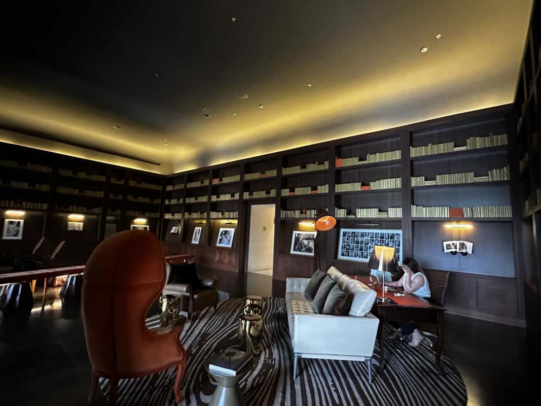 Library with floor to ceiling bookshelves in Yoo Panama condominium