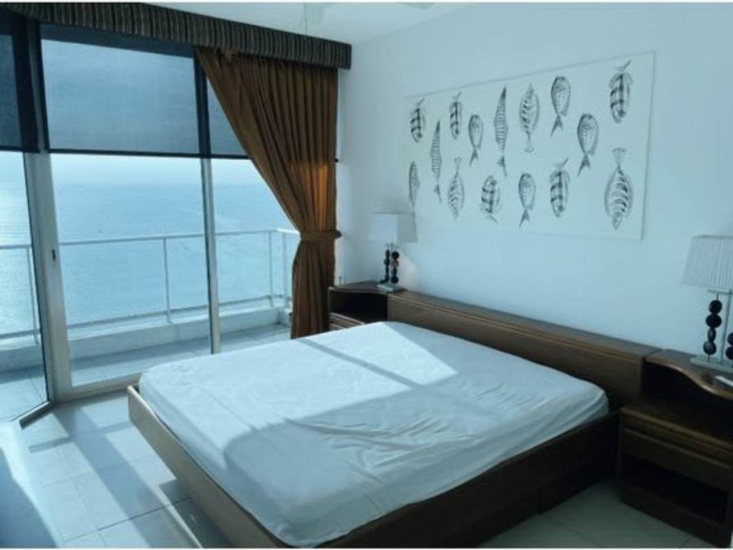 Bathroom with double vessel sinks, mirror, and glass-enclosed shower in PH Destiny Tower Panama