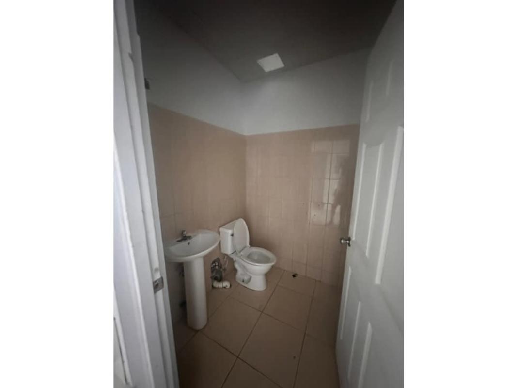 White-tiled retail space with natural light PH Alegria Panama