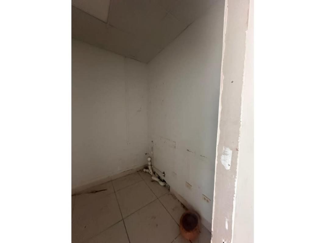 Utility or storage closet with exposed pipes and tiled flooring PH Alegria Panama